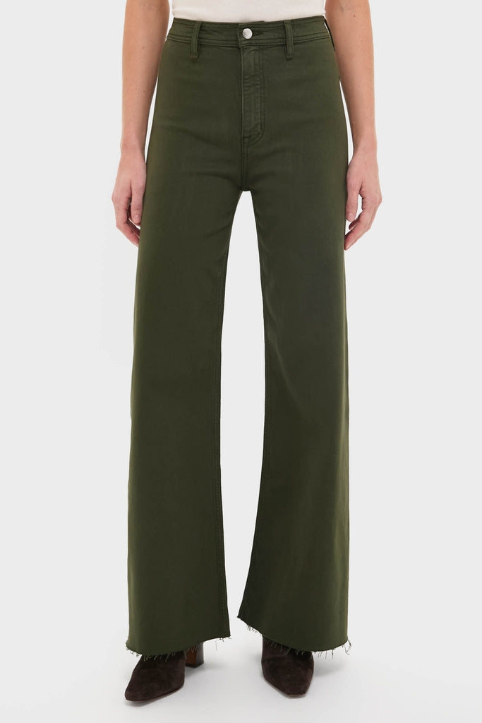 Laurel Penny High Rise Wide Leg trousers showcase a classic, effortless style with raw-edge hems, paired with a white top and brown suede ankle boots for high-end fun.