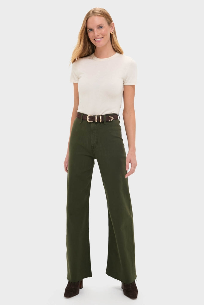 Woman wearing Laurel Penny High Rise Wide Leg trousers with a classic, effortless style; paired with a tucked cream top and dark brown heeled ankle boots.