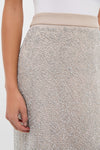 Blush Sparkle Belle Slip Skirt in taupe, adorned with sparkly silver sequins. Classic, effortless pencil silhouette with grosgrain waistband, perfect for fun, high-end occasions.