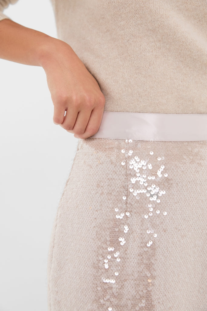 Champagne Sequin Clayton Midi Skirt with grosgrain waistband, showcasing classic, effortless sparkle. Perfectly paired with a knit top for a high-end, fun style.