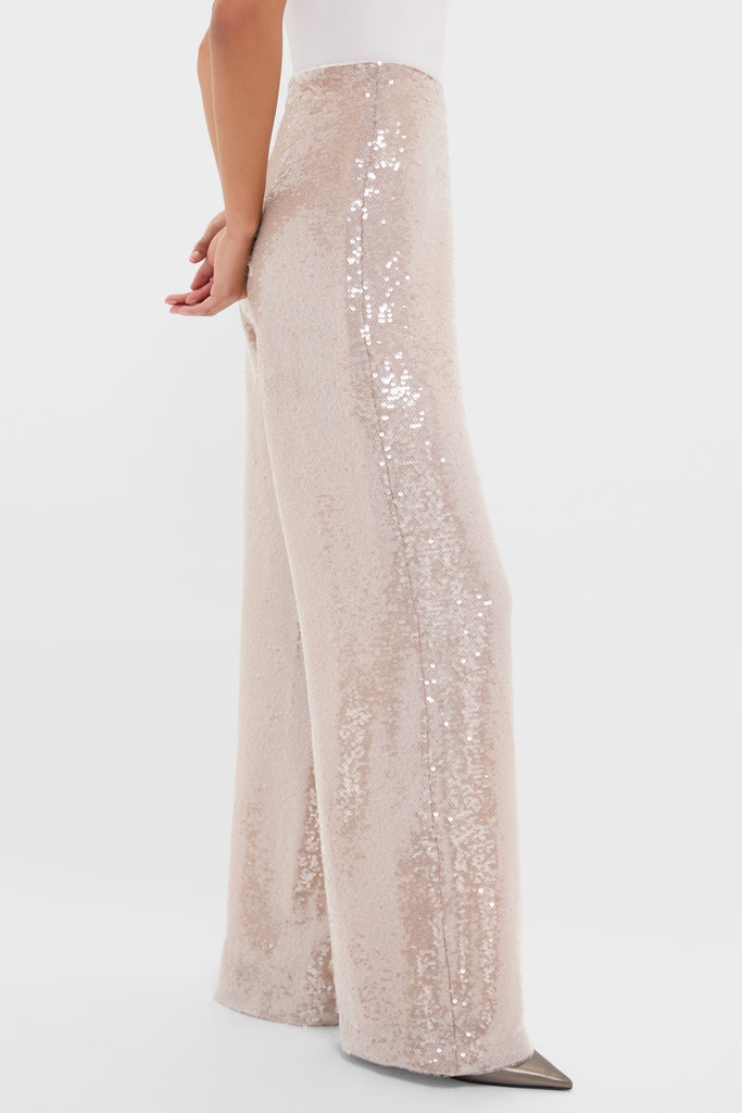 Model showcasing the Champagne Sequin Tatum Pants, high-rise, wide-leg trousers with a classic, effortless sparkle, perfect for a high-end, fun cocktail look.