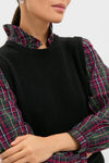 Tartan Ella Sweater Blouse: A classic, high-end sleeveless knit layered over a plaid blouse, offering an effortless, fun style perfect for festive occasions.