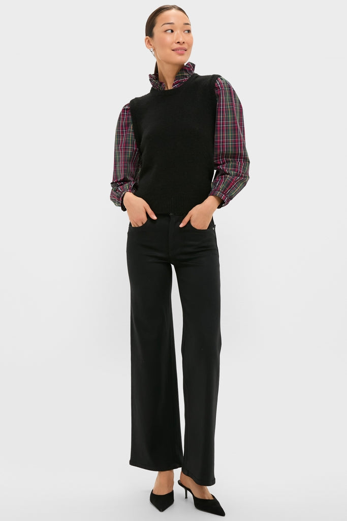 Model wearing the Tartan Ella Sweater Blouse, styled with a classic sleeveless vest, wide-leg trousers, and heels, exuding an effortless, high-end, and fun look for holiday events.