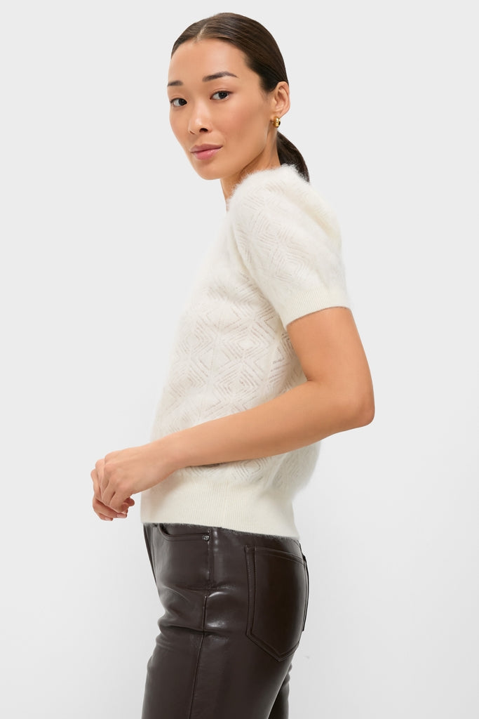 Ivory Brushed Merino Wool Puff Sleeve Lexie Sweater, featuring a classic diamond knit pattern, styled effortlessly with high-end, dark leather pants for a fun, minimalist look.