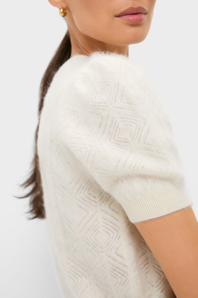 Ivory Brushed Merino Wool Puff Sleeve Lexie Sweater showcases classic puff sleeves and diamond knit, embodying an effortless, high-end style with fun, chic details.