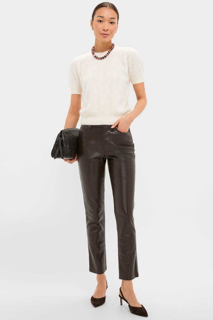 Ivory Brushed Merino Wool Puff Sleeve Lexie Sweater styled effortlessly with sleek leather pants and chic accessories, embodying a classic and fun high-end fashion vibe.