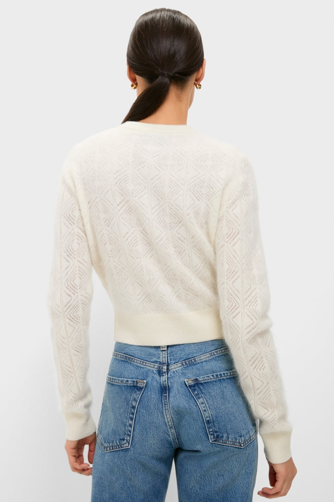 Model wearing the classic Ivory Brushed Merino Wool Macy Cardigan, showcasing its effortless style and subtle diamond texture, paired with high-waisted denim for a fun, high-end look.