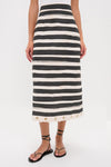 Black Stripe Story Pencil Skirt with eyelet rope detail, exuding classic elegance. Paired with black strappy sandals for an effortless, high-end look.
