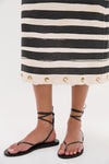 Black Stripe Story Pencil Skirt, featuring classic rope-through-grommet details, paired with black sandals. Effortless and high-end, perfect for warm weather.