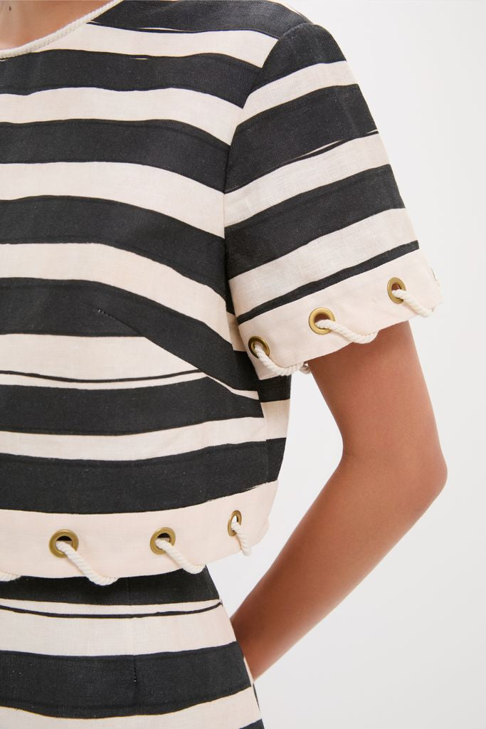 Close-up of the Black Stripe Story Top, featuring classic wide stripes and nautical grommet details. Effortlessly chic and fun, perfect for a high-end, confident look.