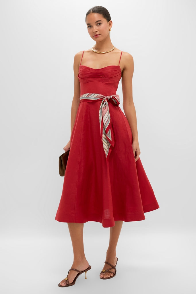 Model wearing the Red Rebellion Tuck Midi Dress, showcasing its classic, effortless style with a ruched bodice, flared skirt, and high-end details.