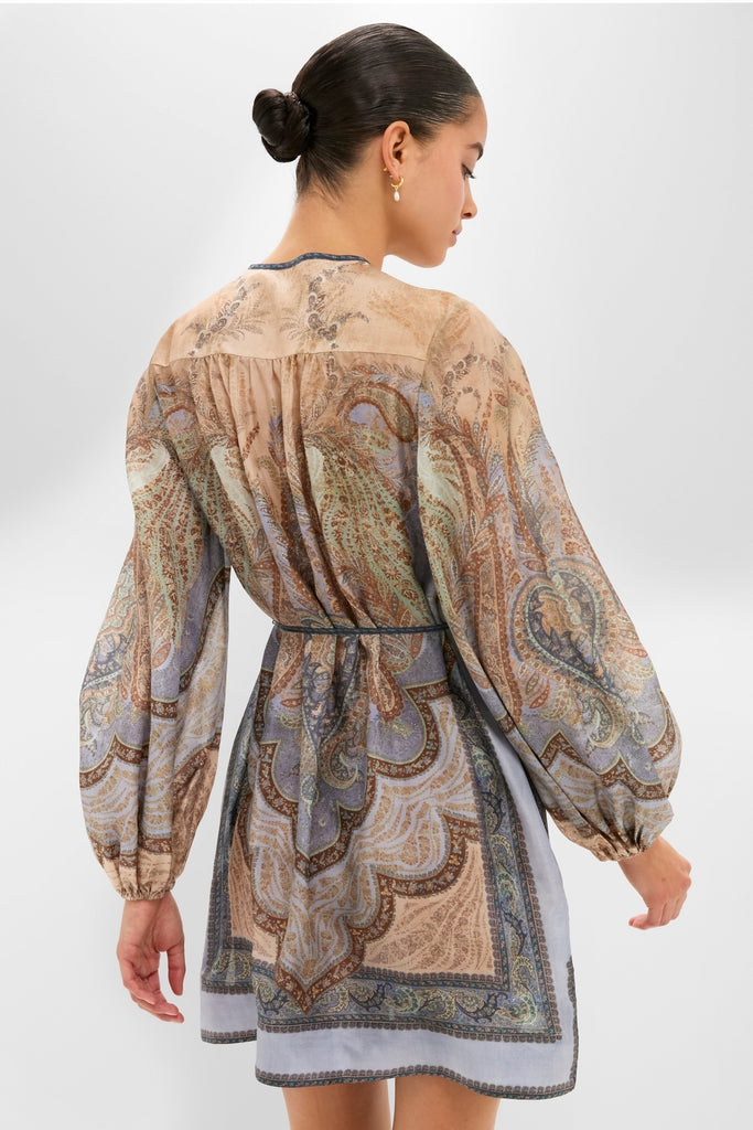 Woman in a classic, effortless Tapestry Blue Multi Wanderlust Tunic with billowy sleeves and a tie waist, capturing a fun, high-end style.