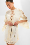 Model wearing Cream Awaken Embroidered Tunic, a classic, high-end dress with lace detailing and a cinched waist, embodying effortless style and sophistication.