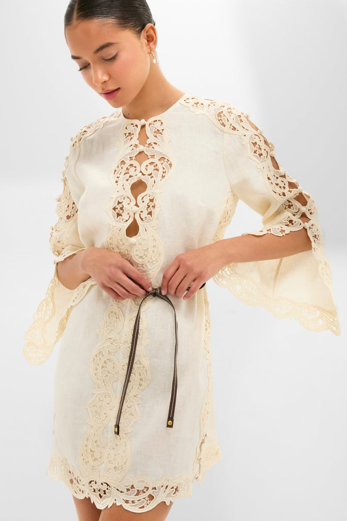 Model wearing Cream Awaken Embroidered Tunic, a classic, high-end dress with lace detailing and a cinched waist, embodying effortless style and sophistication.