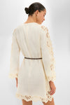 Cream Awaken Embroidered Tunic showcasing intricate scalloped lace trim, effortless style with a leather belt, and classic elegance for a high-end, fun, and confident look.