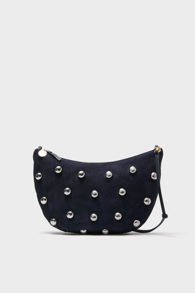 Navy Suede Lune Bag: A classic, crescent-shaped clutch with silver studs, zipper closure, and versatile strap. Effortlessly fun and high-end, perfect for any adventure.