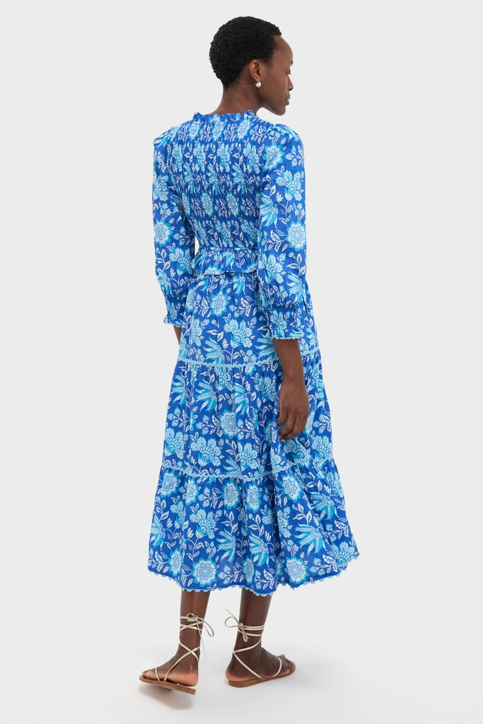Ink Jaal Mia Dress: A classic, effortless midi dress featuring a smocked bodice, tiered skirt, and self-tie belt, styled with fun, high-end lace-up sandals.