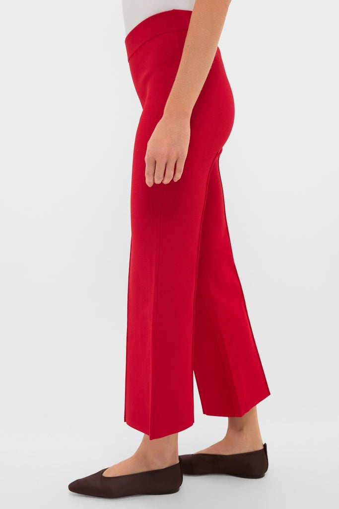 Deep Red Rene Pull On Pant with kick flare and elastic waistband, embodying classic and effortless style, paired with dark brown flats for a fun, high-end look.