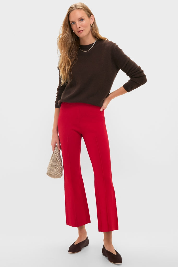 Woman in chocolate sweater and Deep Red Rene Pull On Pant, showcasing a classic, effortless style with fun, high-end kick flare and tailored fit.