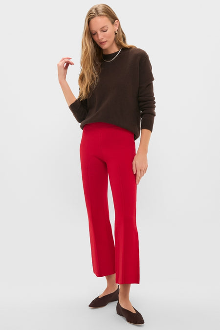 Woman models Deep Red Rene Pull On Pant, showcasing classic, effortless style with a kick flare, elastic waistband, and center seam detail for a fun, high-end look.