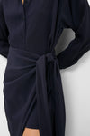 Midnight Alessandra Sarong Shirt Dress: classic, high-end navy blouse with button-front, long sleeves, and an effortless fabric tie, creating a fun wrap skirt effect.