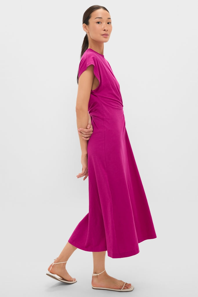 Fuchsia Volta Twist Dress: A classic, high-end midi dress with capped sleeves and waist twist detail, styled with effortless, strappy sandals for a fun, confident look.