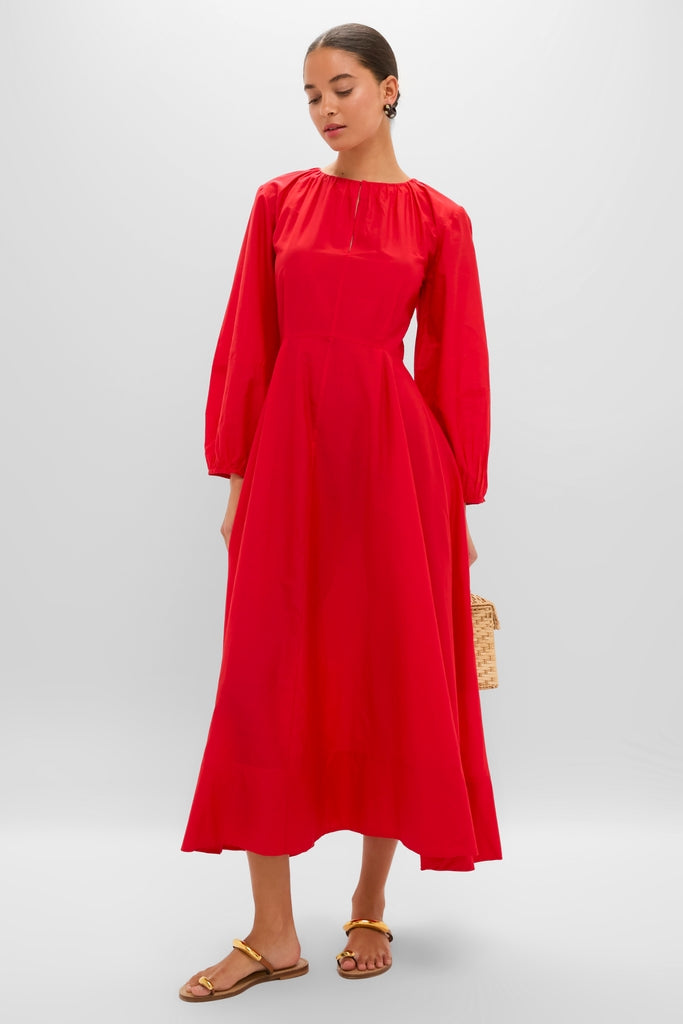 Model wearing the Tigerlily Bonita Dress, a classic and effortless ankle-length piece, paired with a woven handbag and flat sandals, embodying high-end fun style.