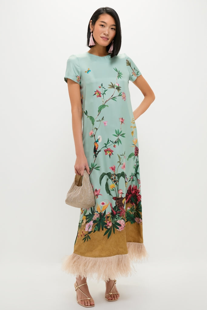 Zooflora Panel Swing Dress with Feathers: A classic, effortless event dress featuring botanical prints, contrasting feather trim, complemented by fun pink tassel earrings and high-end gold sandals.
