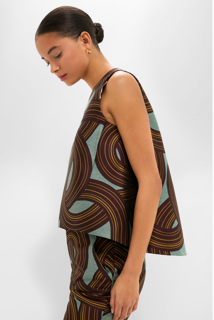 Montecarlo Jacquard La Scala Top in a classic trapeze silhouette, sleeveless with an asymmetrical hem, worn by a woman, embodying effortless, high-end, fun fashion.