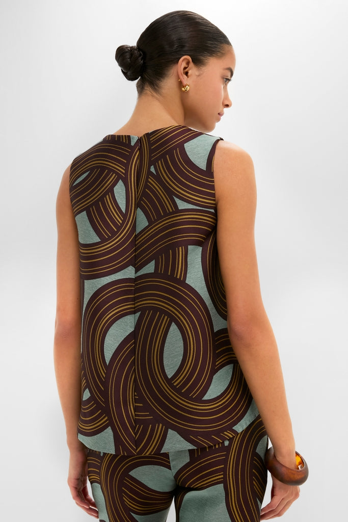 Young woman models the Montecarlo Jacquard La Scala Top, featuring a classic trapeze silhouette and asymmetrical hem, paired with matching pants for an effortless, high-end look.