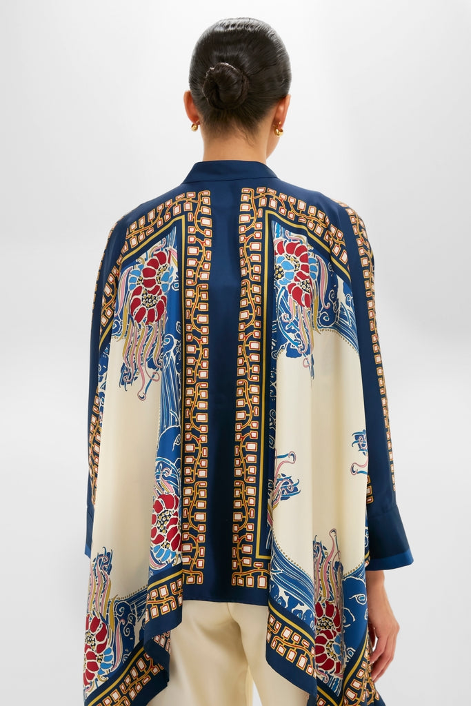 Model wearing the classic Lemuria Placee Foulard Shirt, an effortless, high-end silk top with scarf-style print, exuding fun elegance and chic draped design.