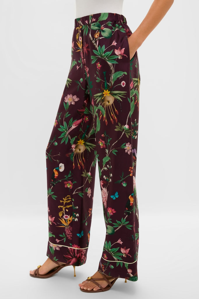 Model wearing Zooflora Pajama Pants with a classic wide-leg silhouette, botanical motif, and elastic waist; paired with strappy sandals, reflecting effortless, high-end style.