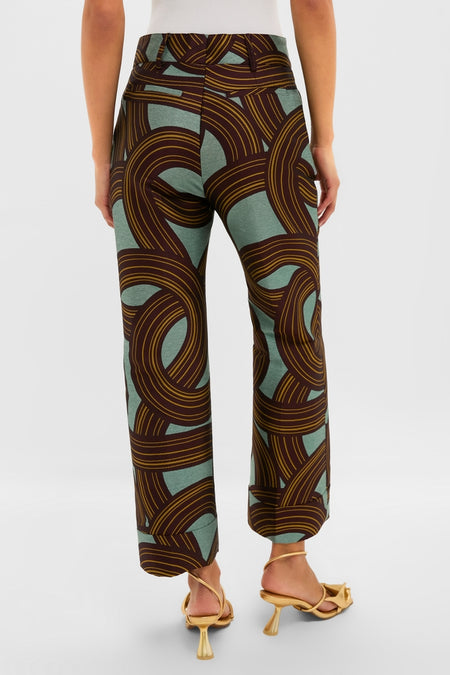 Woman in Montecarlo Jacquard Hendrix Pants with bold stripes, high-waisted fit, and open-toe sandals; exuding classic, effortless, high-end style for fun and confident occasions.