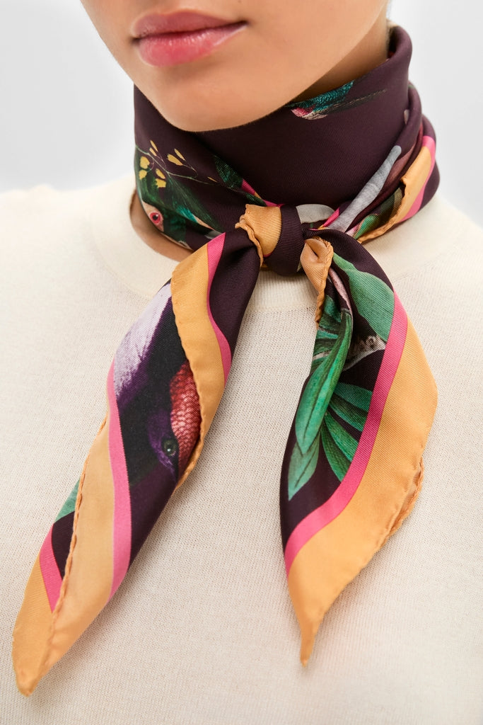 Zooflora Burgundy Foulard 90x90 Scarf, featuring a sophisticated botanical and bird motif, tied effortlessly around the neck, exuding classic, high-end style.