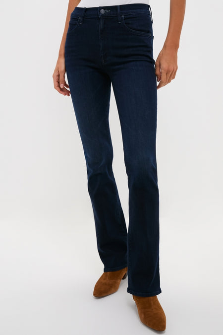 Model wearing Karaoke in Kyoto The Mid Rise Smokin Skimp jeans, showcasing a classic, effortless boot-cut style paired with brown suede ankle boots against a white background.