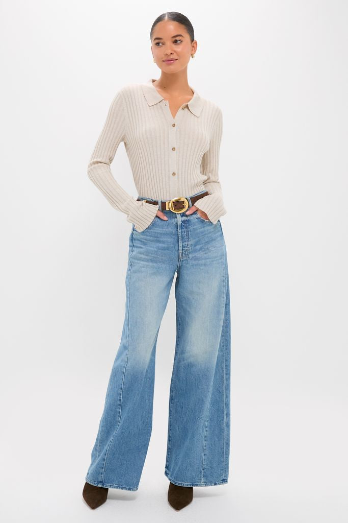Model wearing the classic Folk Star The Pipe-Dream Button Sneak, an effortlessly chic rib-knit top with wide-leg jeans and high-end accessories for a fun, sophisticated look.