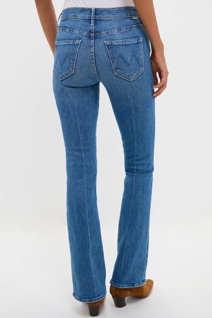 Hokey Pokey The Outsider Sneak: Classic mid-blue bootcut jeans with a clean hem, effortlessly paired with brown heeled ankle boots for a fun, high-end look.