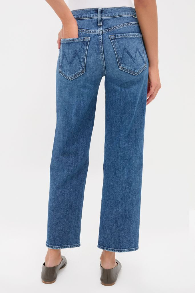 Person wearing Tambourine Man The Mid Rise Rambler Zip Ankle jeans, showcasing classic, effortless style with high-end stitching, paired with a tucked-in top and slip-on shoes.