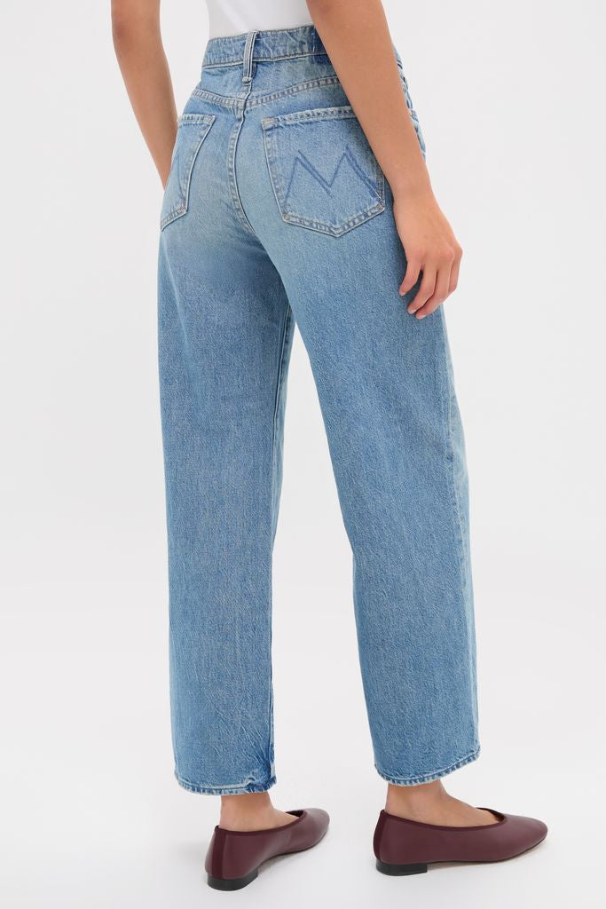 A person wearing Folk Star The Dodger Flood jeans with stitched M detail and ballet flats, showcasing a classic, effortless, and high-end style.