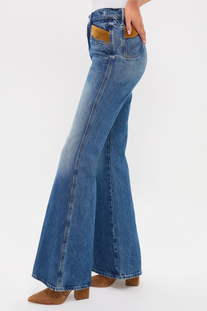 Model showcasing the Remember When The Pointy Pocket Doozy Heel with classic, high-waisted flared jeans, featuring tan corduroy back pocket accents and effortless, fun suede ankle boots.