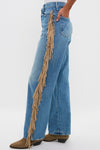 Folk Star The Fringe Half-Pipe Button Sneak jeans feature classic wide-leg denim with effortless tan-suede fringe detailing, paired with fun and high-end brown suede boots.