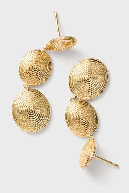 Gold Ruby Earrings: Classic gold-tone drop earrings with three spiral discs, offering an effortless, high-end look. Ideal for adding a fun, sculptural touch to any outfit.