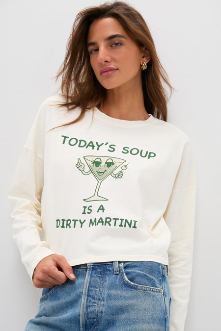 Person wearing the classic Martini Soup Crop Long Sleeve Tee, featuring a fun cartoon martini design. Effortless style paired with high-end light-wash jeans.