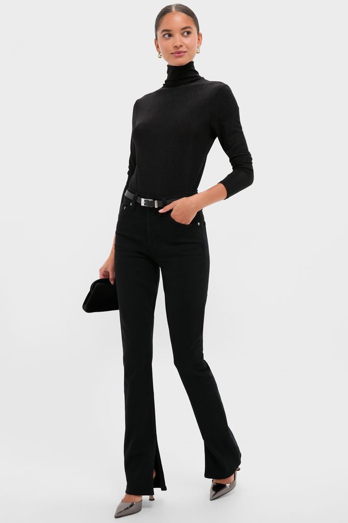 Model in classic Immersion Ingram Split Skinny pants, styled with a fitted turtleneck, metallic pumps, and a clutch, exuding effortless, high-end fashion.