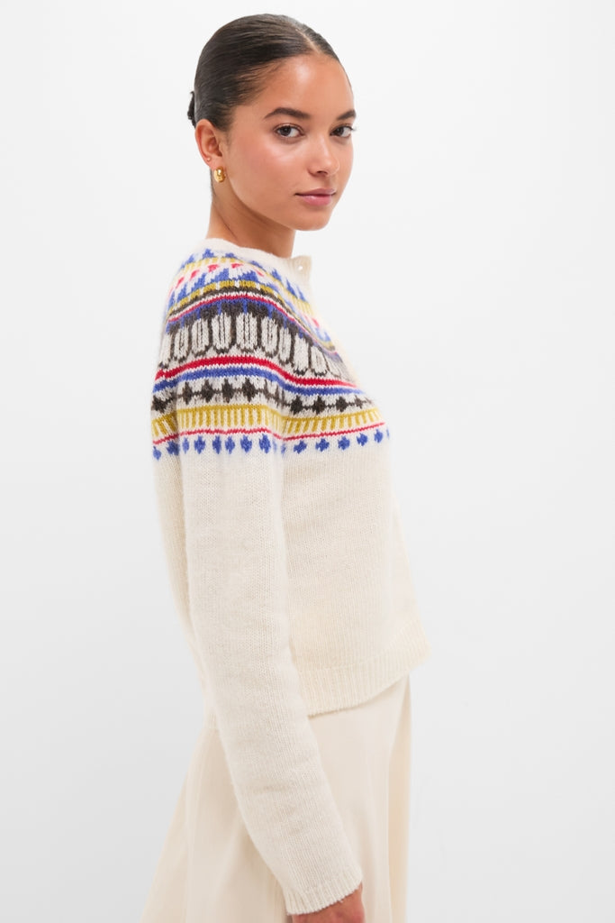 Model in profile wearing the classic White Amina Fairisle Sweater, featuring an effortless, colorful yoke. The look is high-end and fun, embodying Tuckernuck's style.