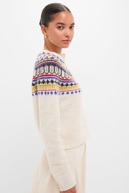 Model in profile wearing the classic White Amina Fairisle Sweater, featuring an effortless, colorful yoke. The look is high-end and fun, embodying Tuckernuck's style.