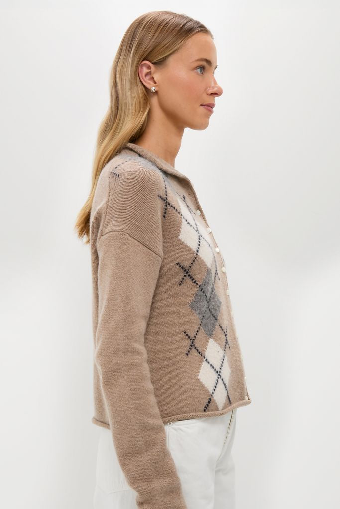 Young woman in profile wearing the classic Oatmeal Taylor Cardigan with vintage Argyle pattern, showcasing an effortlessly chic, high-end style with fitted sleeves and roll-edge details.