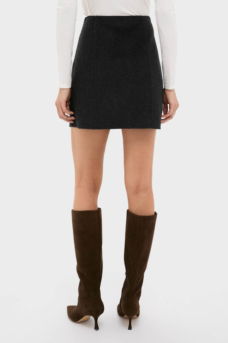 Classic Black Naomi Mini Skirt with A-line silhouette, paired effortlessly with high-end suede knee-high boots for a fun, versatile style. Ideal for every occasion.