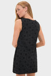 Black Salma Mini Dress in floral eyelet pattern, exuding effortless elegance and classic style, perfect for a fun, high-end, and confident look.