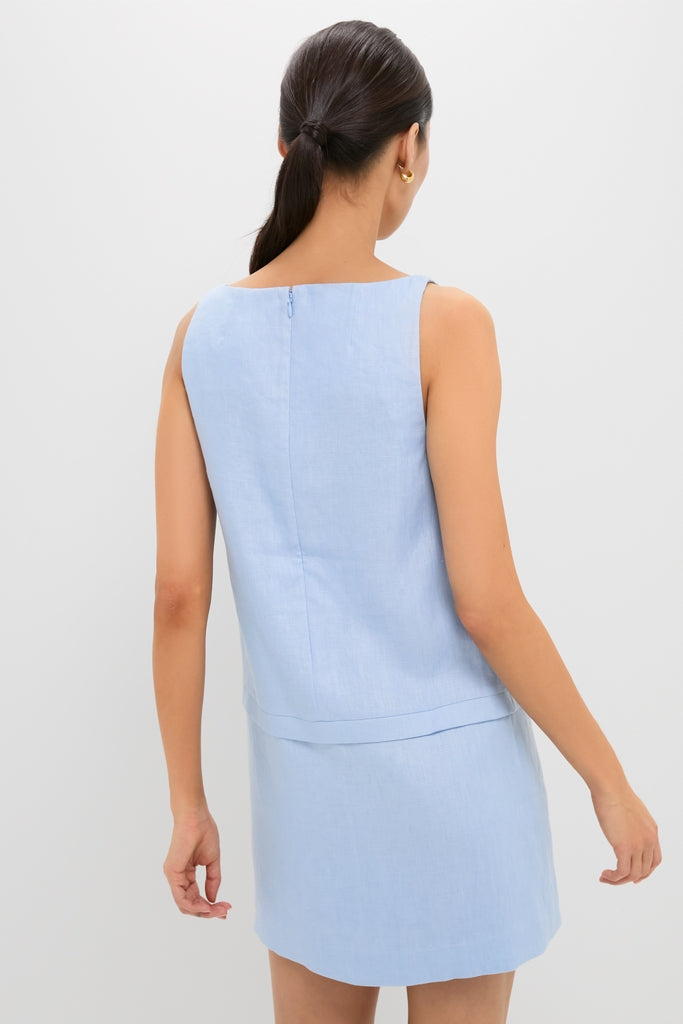 Woman wearing the Blue Harper Mini Dress, a classic, sleeveless outfit with a small back zipper, embodying effortless and high-end style, perfect for fun and confident occasions.